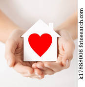 hands holding white paper house hands holding white paper house