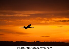 airplane takeoff in sunset airplane takeoff in sunset