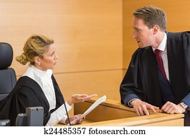 Lawyer speaking with the judge Lawyer speaking with the judge