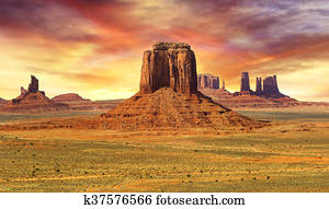 sunset on the wild landscape of monument valley