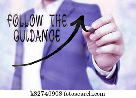 Writing note showing Follow The Guidance. Business photo showcasing controlling a course of projectile by builtin mechanism Digital arrowhead curve denoting growth development concept.