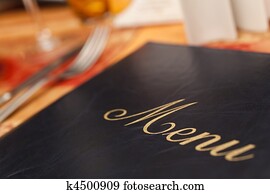 Menu & Cutlery on A Restaurant Table Menu & Cutlery on A Restaurant Table