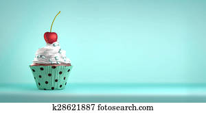 Delicious cupcake topped with a cherry and sweeties. Delicious cupcake topped with a cherry and sweeties.