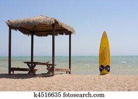 surfboard and beach hut