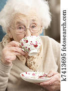 Senior Woman Enjoying Cup Of Tea At Home