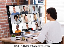 Businesswoman Video Conferencing With Businessman Businesswoman Video Conferencing With Businessman