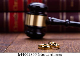 Close-up Of Wedding Rings With Gavel Close-up Of Wedding Rings With Gavel