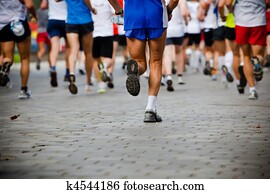People running in city marathon People running in city marathon