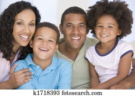 Family in living room smiling Family in living room smiling