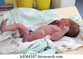 Newborn baby on table at hospital Newborn baby on table at hospital