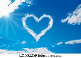 Heart Shaped Cloud In Blue Sky