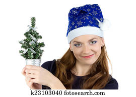 Photo of woman with small christmas tree