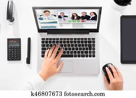 Businesswoman Chatting With Her Colleague On Video Conference