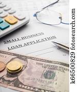 small business loan application on the desk.