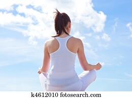 Concentrated woman meditating