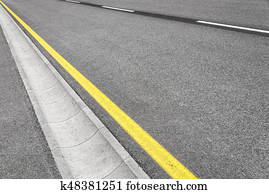 Drain channel on the asphalt road.