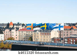 Fluttering Scandinavian flags against the sky