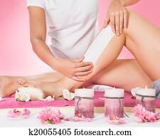 Therapist Waxing Customer's Leg At Spa Therapist Waxing Customer's Leg At Spa