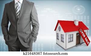 Businessman with small house Businessman with small house