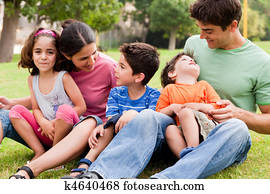 Happy family enjoying summer day in the park
