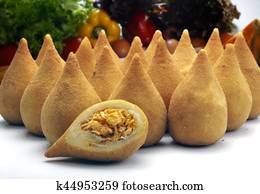 Coxinha de Galinha - Brazilian deep fried chicken snack, popular at local parties. Served with chili sauce.