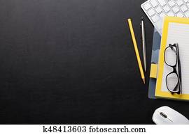 Office desk with computer and supplies