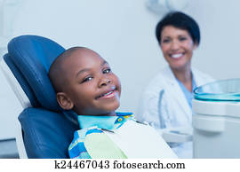 Smiling boy waiting for a dental exam
