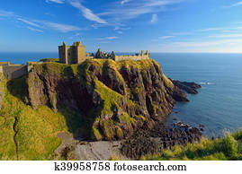 Dunnottar Castle with blue sky background in Aberdeen, Scotland.