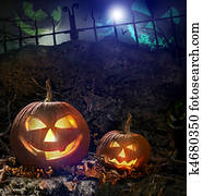 Halloween pumpkins on rocks at night Halloween pumpkins on rocks at night