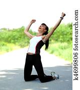 Portrait of an excited young sportswoman rejoicing winning