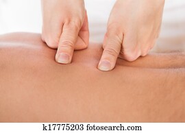 Person Receiving Shiatsu Treatment