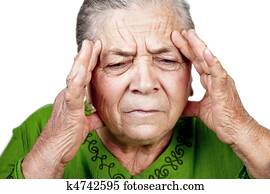 Old senior woman having migraine or headache