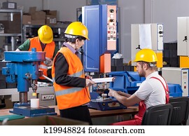 Production worker with boss Production worker with boss