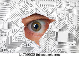Eye looking through a hole in electronic circuit