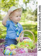 Cute Little Boy Outside Holding Easter Eggs Tips His Hat