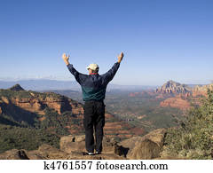 Man praising God from the mountain top