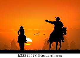 people on horseback at sunset people on horseback at sunset