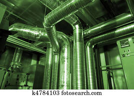 Ventilation pipes of an air condition in green tones Ventilation pipes of an air condition in green tones
