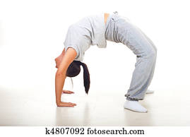 Young woman doing back bend