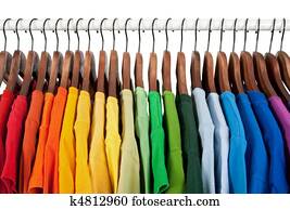 Rainbow colors, clothes on wooden hangers Rainbow colors, clothes on wooden hangers