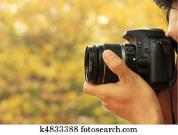 Photographer Taking A Shoot With A Digital Camera Photographer Taking A Shoot With A Digital Camera