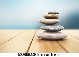 Pile of pebbles on wooden planks Pile of pebbles on wooden planks
