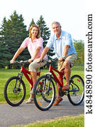 seniors couple biking seniors couple biking