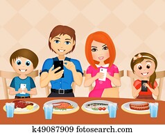 family with cell phone at table family with cell phone at table