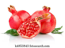 pomegranate fresh fruits with cut and green leaves