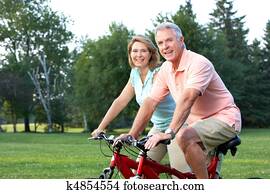 seniors couple biking