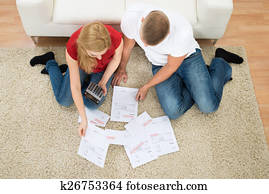 Couple With Bills And Calculator