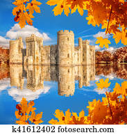 Historic Bodiam Castle with autumn leaves in East Sussex, England