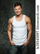 Stylish cheerful man in tank top shirt 