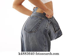 Young woman showing off weight loss